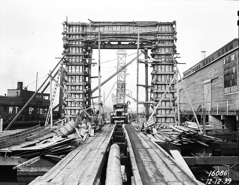 A photo of the Ballard Bridge, originally made of wood, under construction in 1939