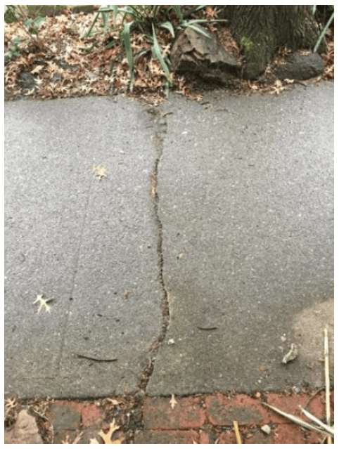 Perpendicular sidewalk crack.