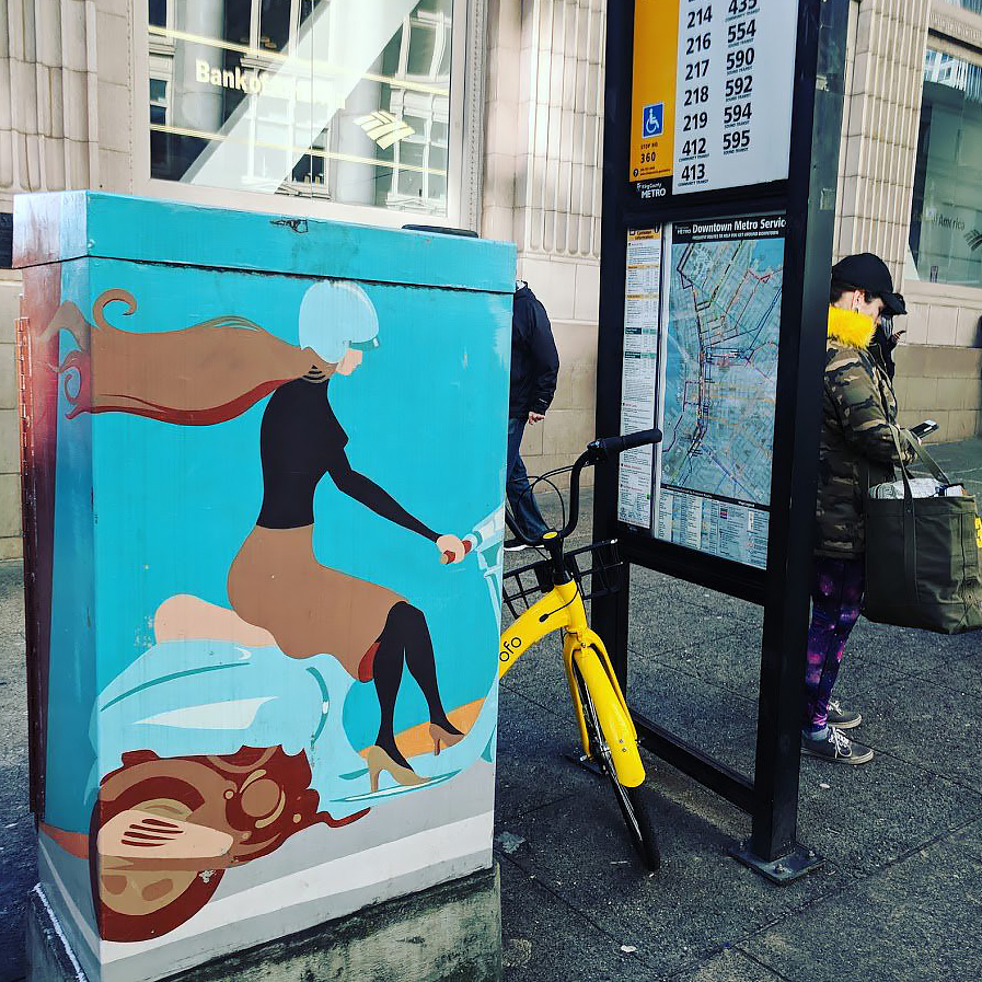 Public Art on Utility Cabinet Blends with Bike Share Bike at Transit Stop