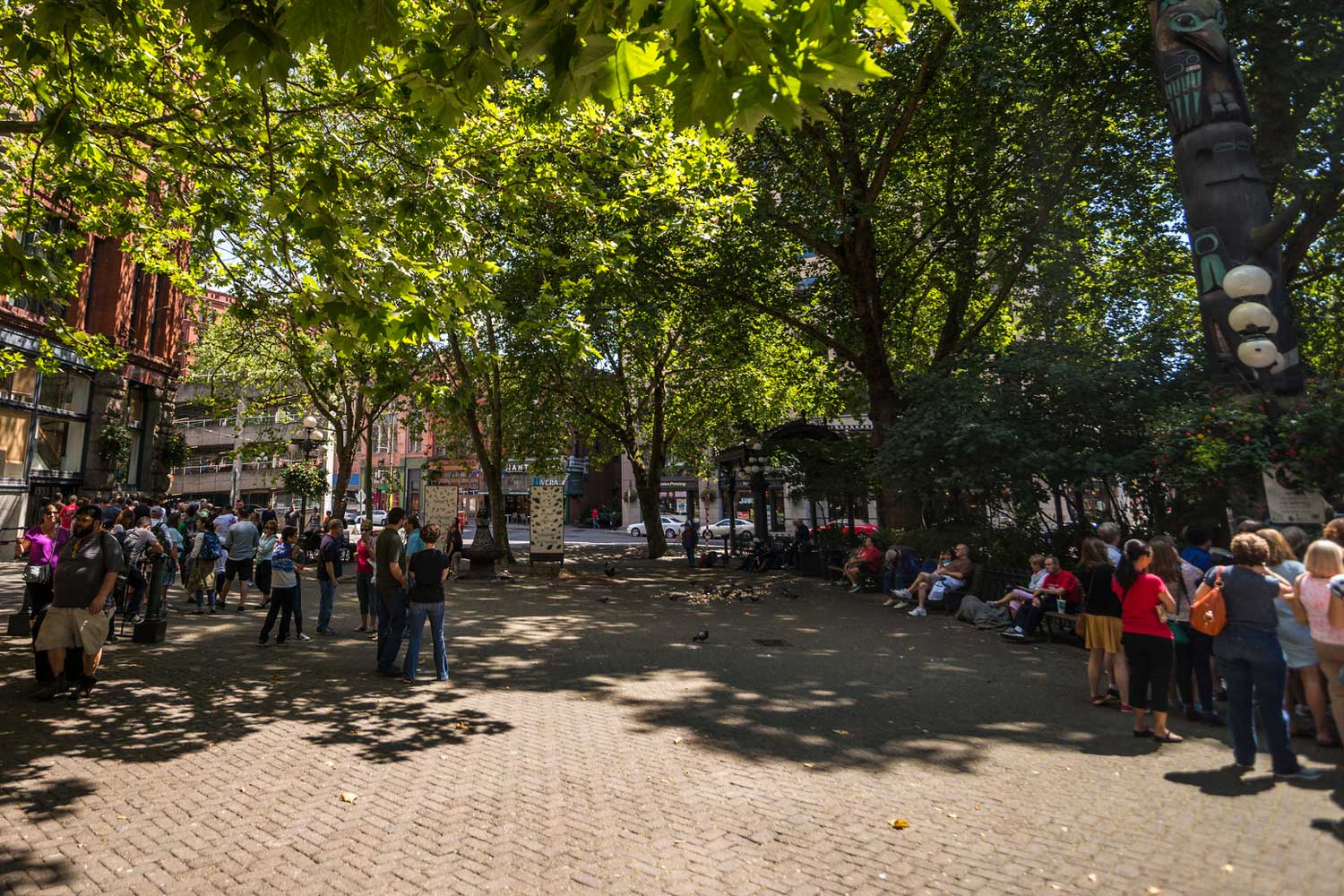 Pioneer Square plaza with visitors - photo by TIA International Photography