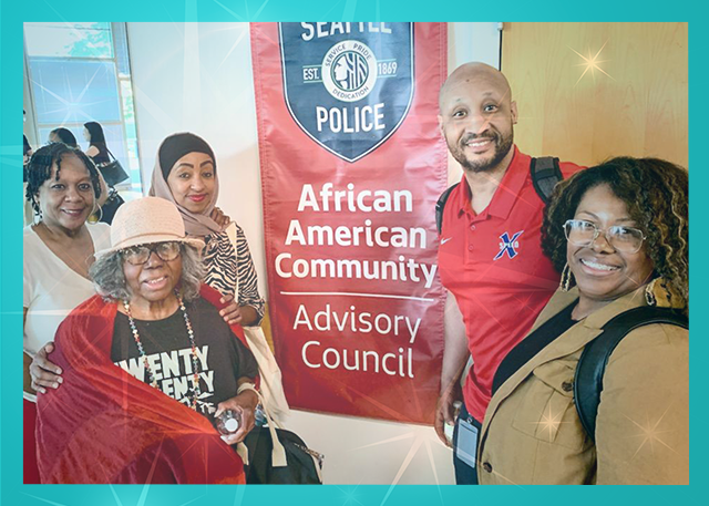 Community Engagement Team with a banner of the African American Community Advisory Council. Left to right in the photo: Felicia Cross, Mergitu Argo, Rev Harriett Walden, Jo-Nathan Thomas, Bessie Scott.