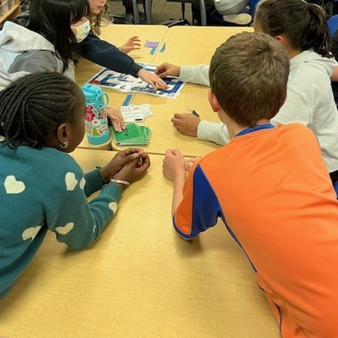 Renewables workshop of kids working together on a game.