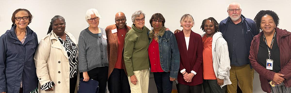 MCAAE members pose for a photo after a meeting.