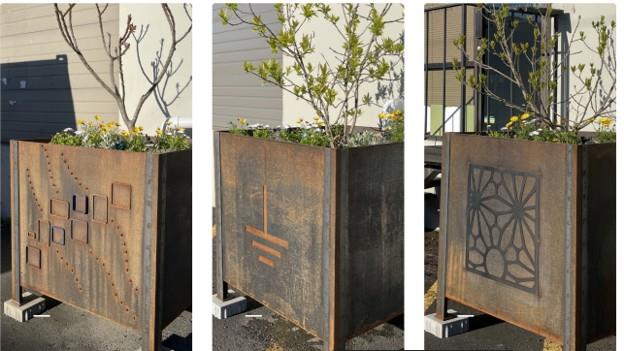 Three metal Grattix boxes: large tree filled planters.