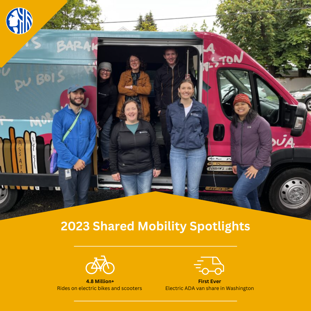 Staff from City Light and SDOT staff celebrate the launch of an ADA-accessible electric vanshare program hosted by Estelita’s Library.