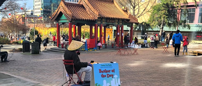 Busker at Hing Hay Park with Pagoda in the background