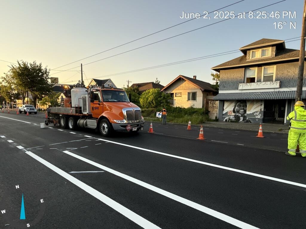 Crews installing pavement markings on the newly paved Beacon Ave S!