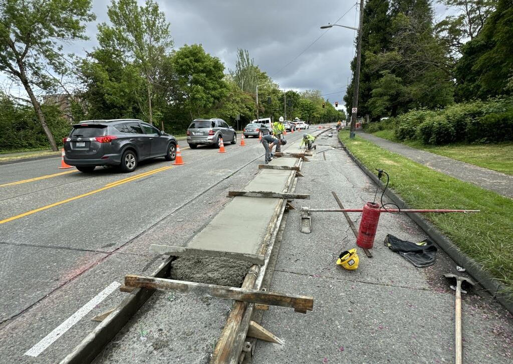 Crews pouring concrete for new protected bike lanes along MLK Jr Way S
