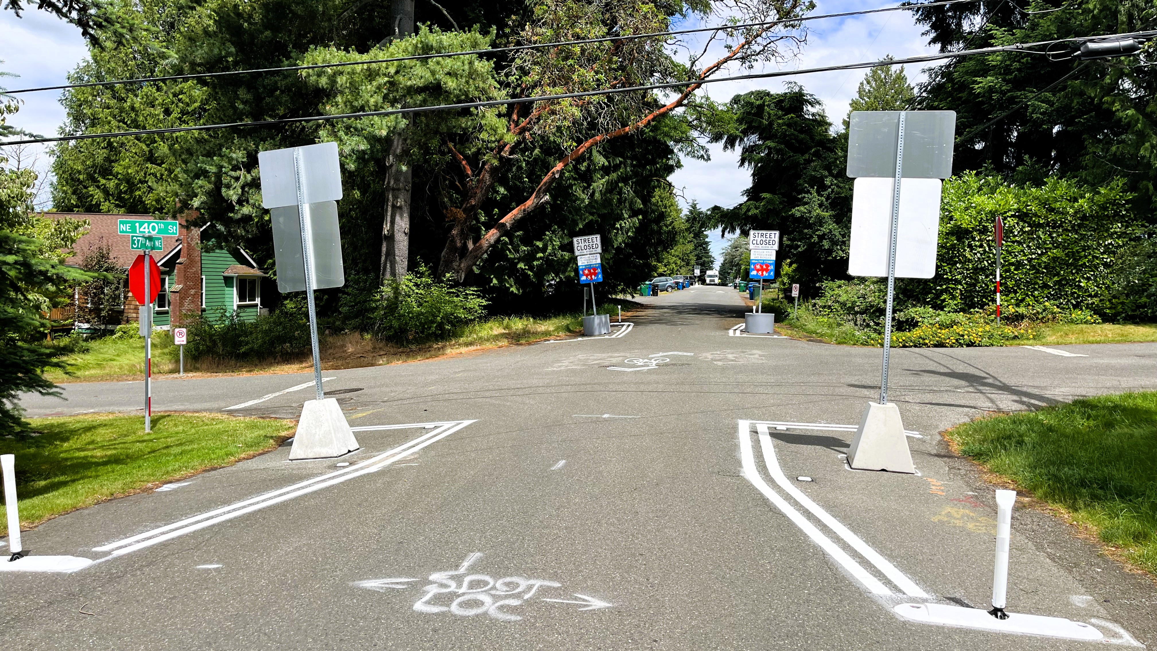 Newly installed permanent Healthy Street signage and bicycle sharrows on the Cedar Park Healthy Street