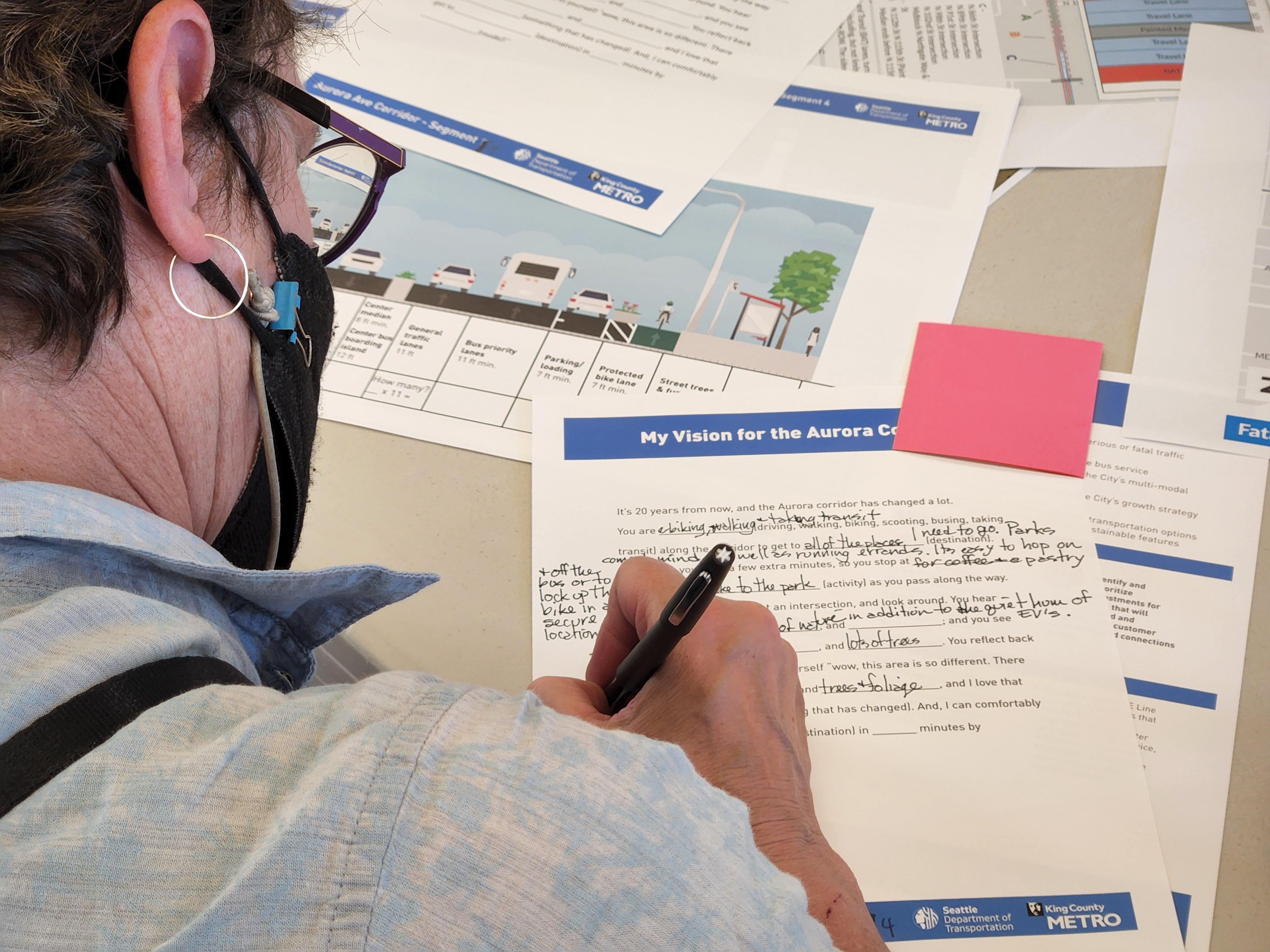 A community member shares their vision for the future of Aurora Ave N during a public engagement session.