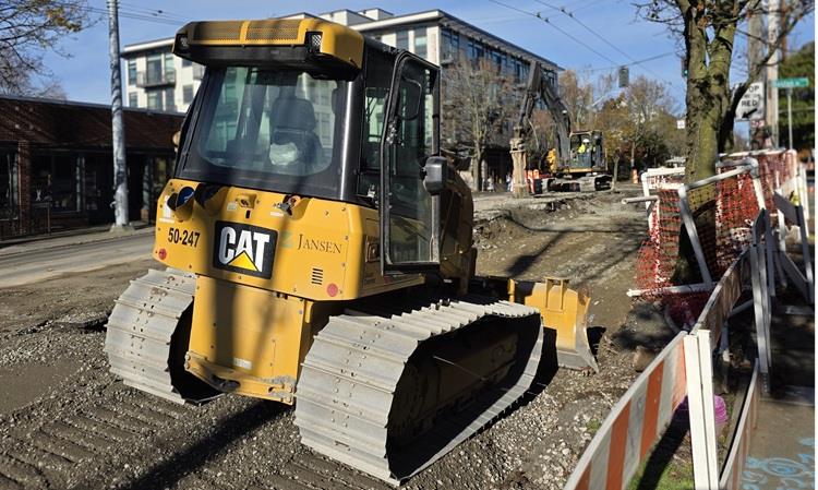 The image shows the team leveling the surface on Eastlake Ave E ahead of pouring concrete for the new street
