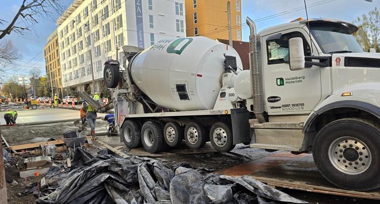 Image shows crews pouring concrete along Eastlake Ave E
