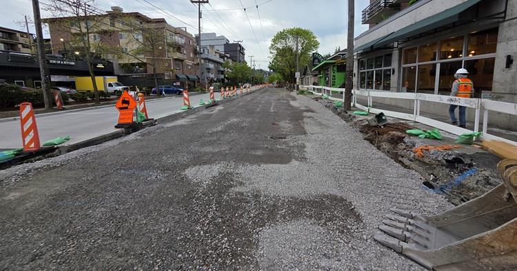 Image shows the prepared road subsurface ready for new concrete on the west side of Eastlake Ave E just south of E Lynn St