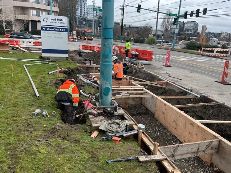 The image shows work at Fairview Ave N and Aloha where we are building a new bus shelter