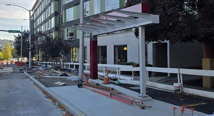 Image shows the first sections of new RapidRide bus shelters being installed in the University District