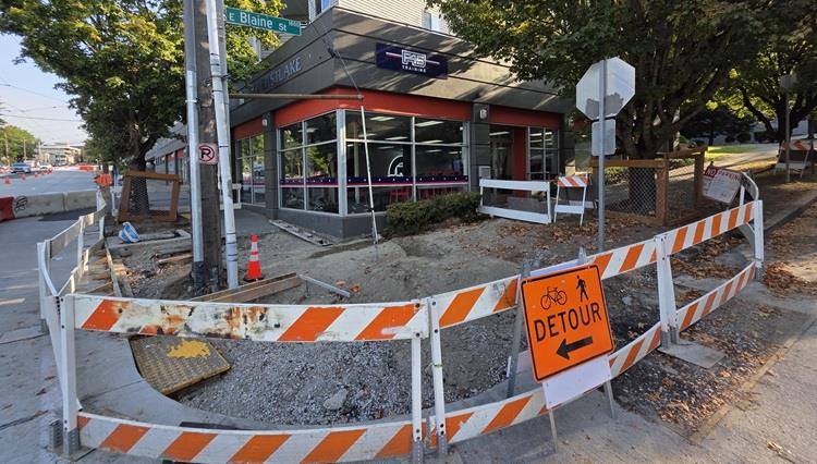 Image shows an area of sidewalks excavated on Eastlake Ave E