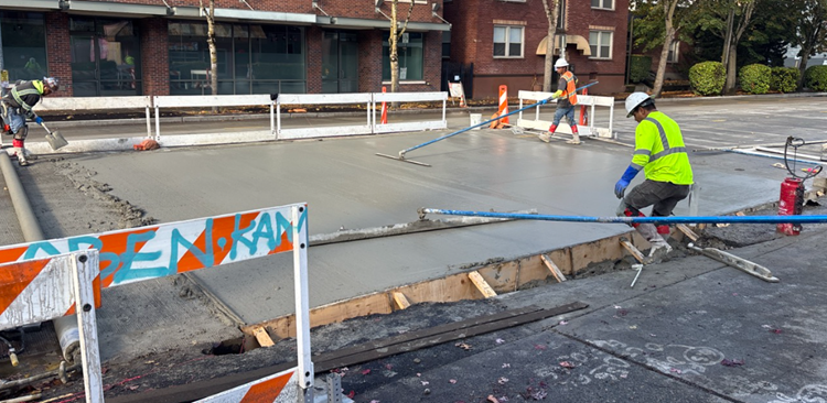 Image shows new concrete being added to Eastlake Ave E