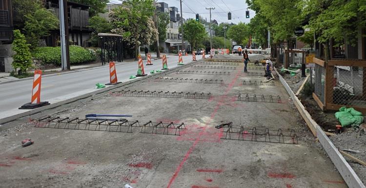 Image shows the prepared road subsurface ready for new concrete on the west side of Eastlake Ave E just south of E Lynn St