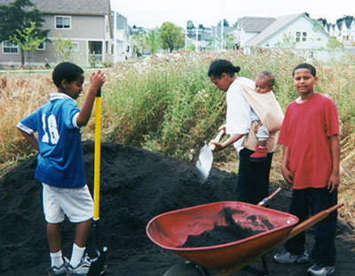 Photo of people spreading compost