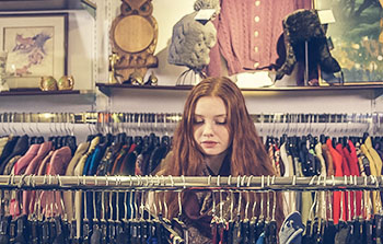 Woman shopping in thrift store