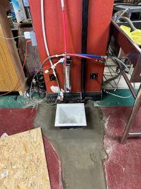 The same section of floor with a new drain installed