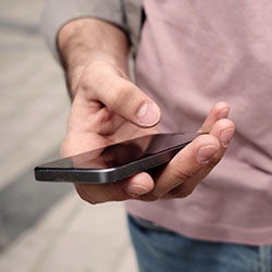 A person checks their cell phone