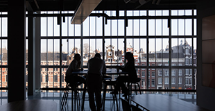 3 people meeting at a table