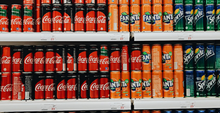 Soda cans on shelves