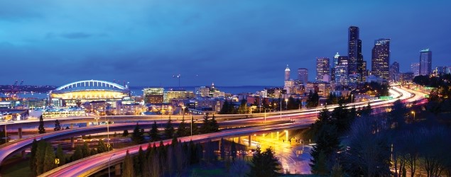 Seattle cityscape at night with freeway photo