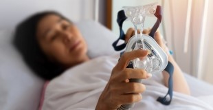 Woman with CPAP machine