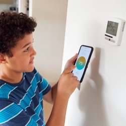 Smart Thermostat and Phone App Photo