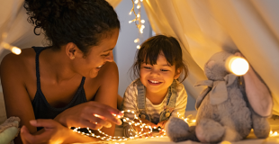 Mother and Daughter in a play tent