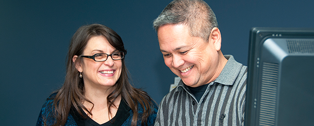 Two people together smiling