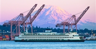 A ferry sailing with Mount Rainier in the background