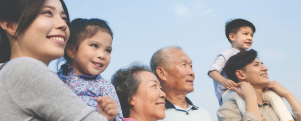 A multi-generational family poses for a picture 