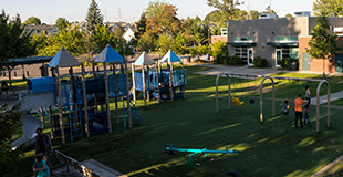 Swingset and climbing structure at Van Asselt Playground