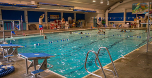 Evans Pool, with a child using the diving board.
