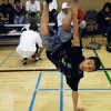 A break dancer in a gymnasium