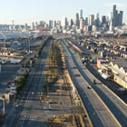 Aerial view of East Marginal Way, looking north, with the Port of Seattle and downtown Seattle visible in the background