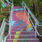 A brightly painted stairway at 12th Ave S and S Trenton