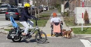 A person using a curb ramp with their wheel chair