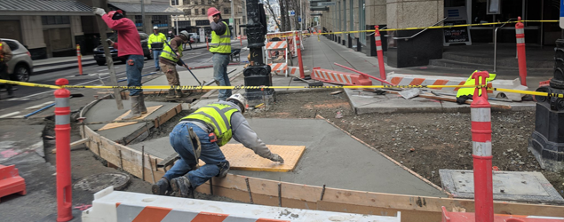 SDOT crew installing ADA ramps in Downtown Seattle