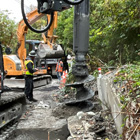 Drilling for piles that will hold the panels for the retaining wall 