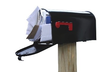 Mail filling up a mailbox.