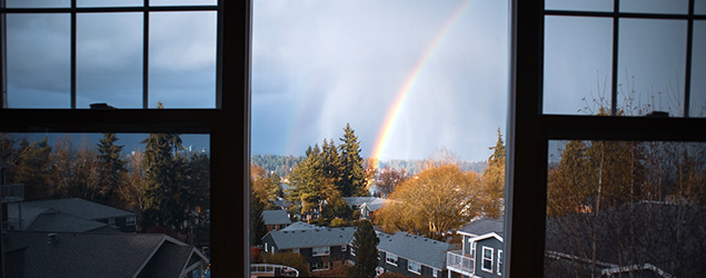 Photo of a rainbow over a Seattle neighborhood