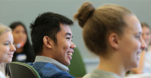 Seattle Youth Commission members sitting at desk