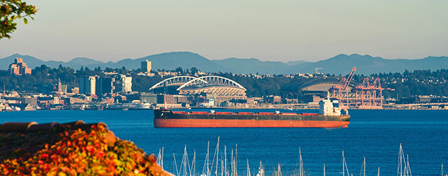 A cargo ship is parked in Seattle's Elliot Bay
