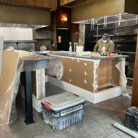 Person working on a commercial kitchen remodel