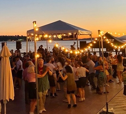 Dancers on a pier at the Seattle waterfront at dusk