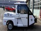 This photo shows a small Seattle Police parking enforcement vehicle from the side. 